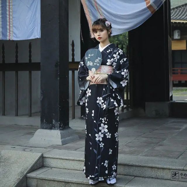 Elegant black kimono dress with blossom design and contrasting panels