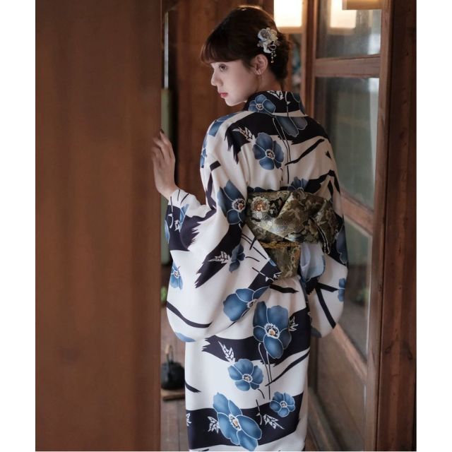 Japanese kimono dress with blue floral pattern and traditional wide sleeves