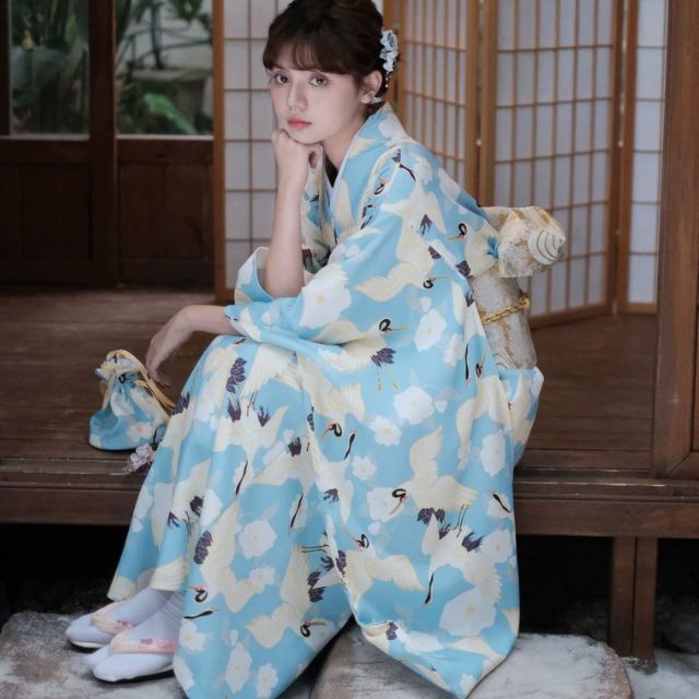 Japanese kimono dress in blue floral pattern with traditional wide sleeves