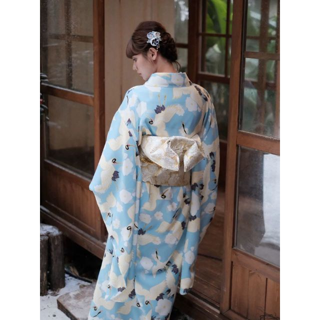 Japanese kimono dress in blue floral pattern with traditional wide sleeves