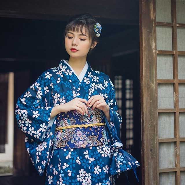 Japanese kimono dress in navy and white with a floral pattern and wide sleeves