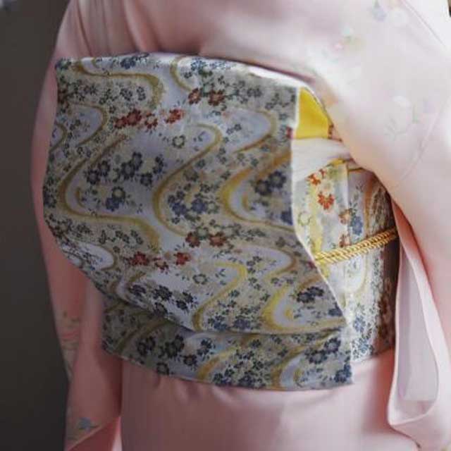 Obi belt with floral pattern worn on pink kimono - Eiyo Kimono