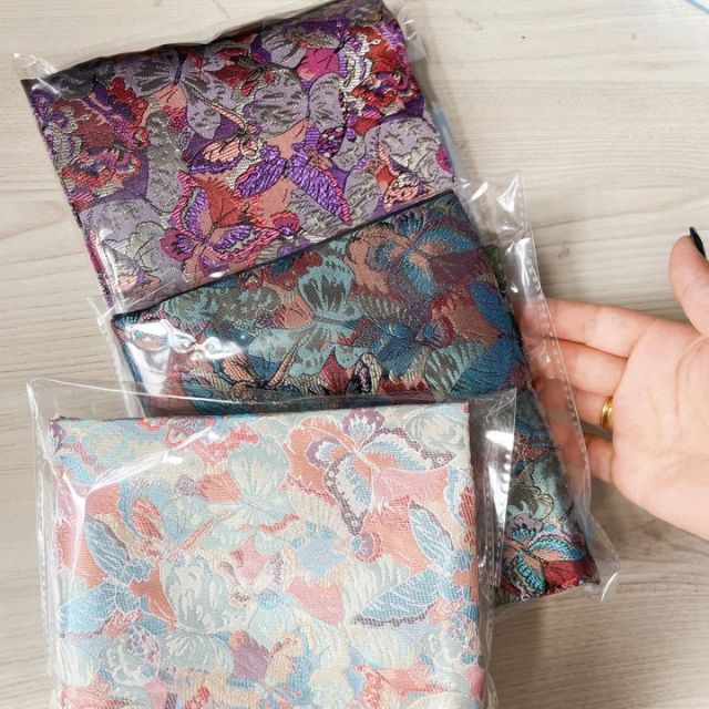 Wide kimono belt with soft floral pattern tied at the waist