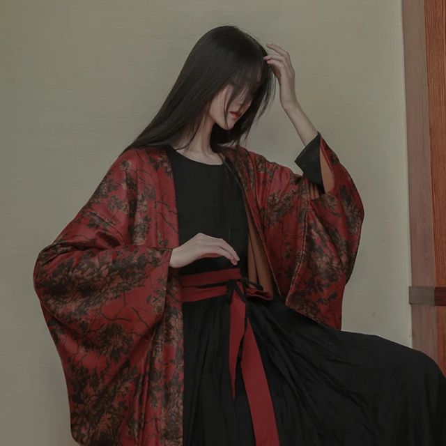 woman wearing a red floral kimono cardigan jacket
