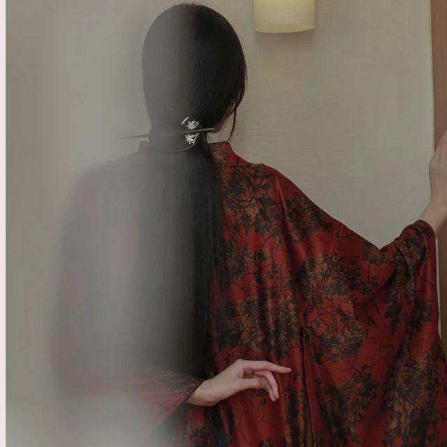 woman wearing a red floral kimono cardigan jacket
