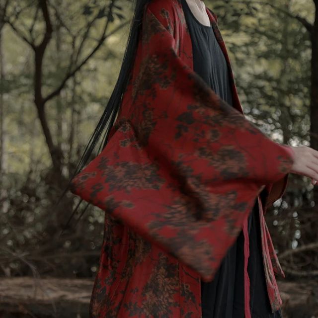woman wearing a red floral kimono cardigan jacket
