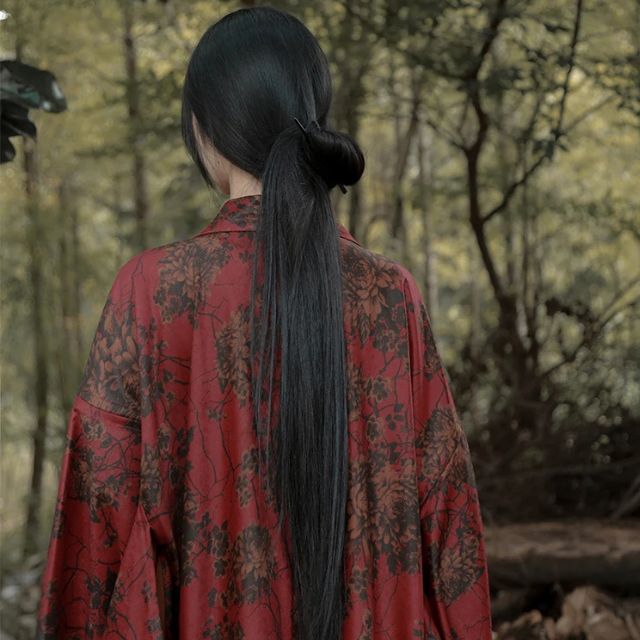 woman wearing a red floral kimono cardigan jacket