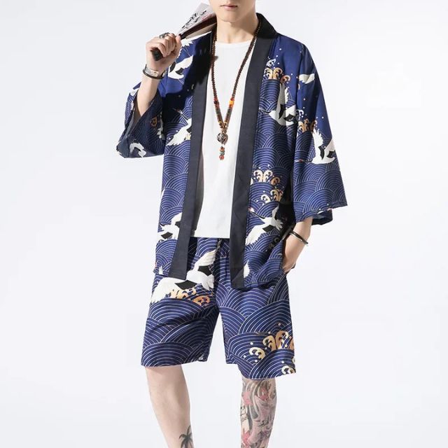 Man wearing open-front navy haori jacket and matching crane print shorts — Japanese-style summer outfit