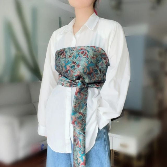 Wide kimono belt with teal floral pattern tied at waist