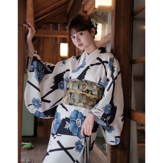 Japanese kimono dress with blue floral pattern and traditional wide sleeves