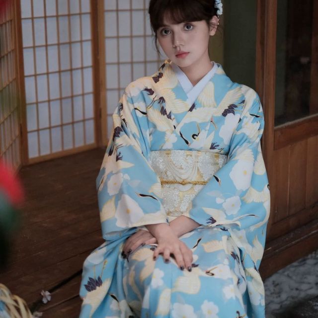 Japanese kimono dress in blue floral pattern with traditional wide sleeves
