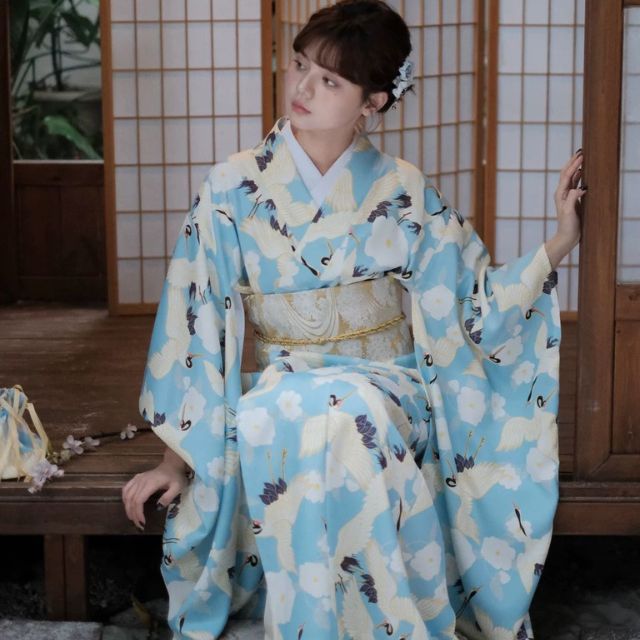Japanese kimono dress in blue floral pattern with traditional wide sleeves