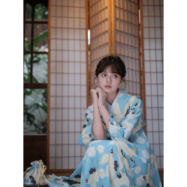 Japanese kimono dress in blue floral pattern with traditional wide sleeves