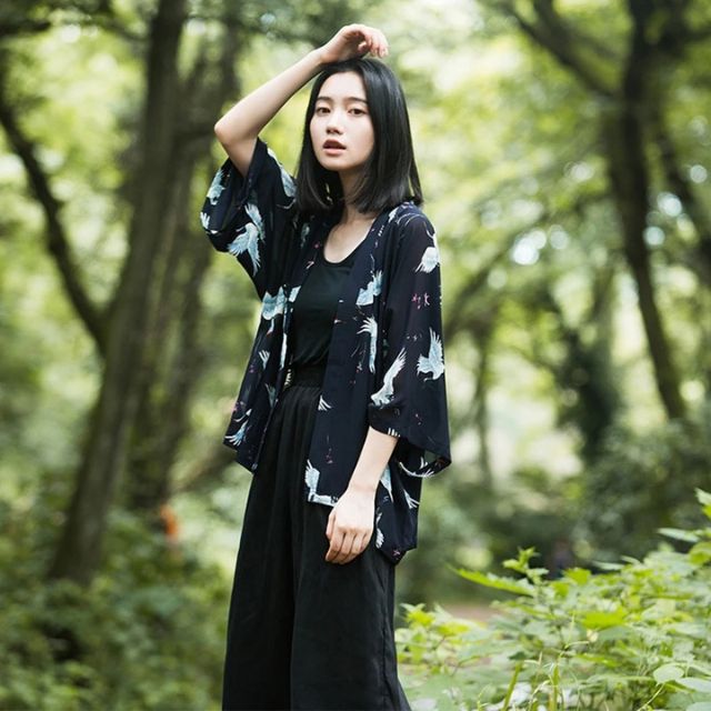 Japanese crane haori kimono in black with flowing silhouette styled as elegant streetwear layer - eiyo kimono