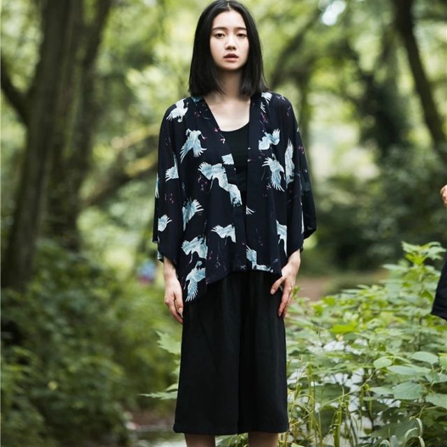 Japanese crane haori kimono in black with flowing silhouette styled as elegant streetwear layer - eiyo kimono