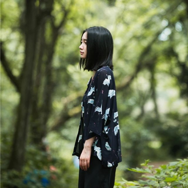 Japanese crane haori kimono in black with flowing silhouette styled as elegant streetwear layer - eiyo kimono