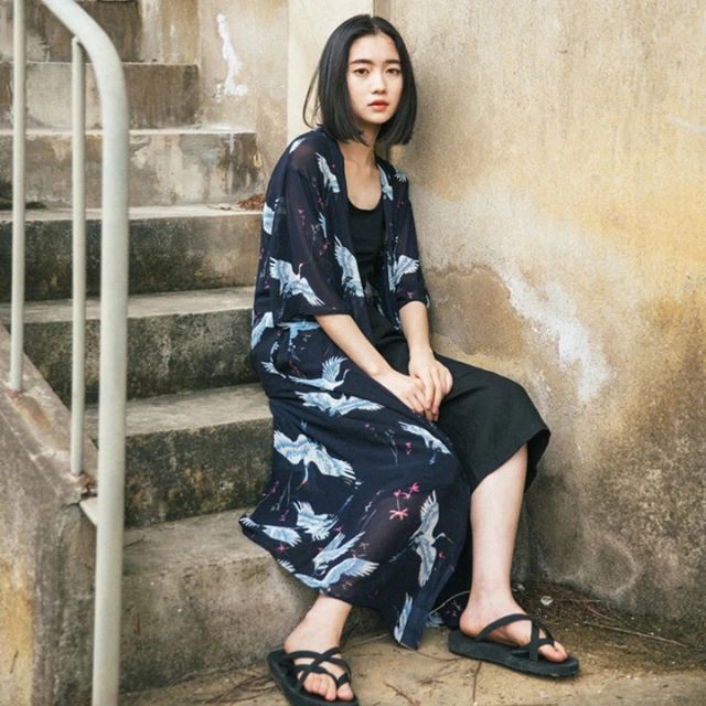 Japanese crane haori kimono in black with flowing silhouette styled as elegant streetwear layer - eiyo kimono